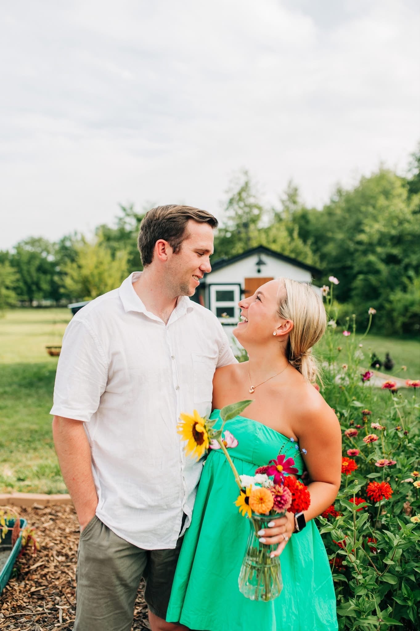 Couple standing in a garden picking flowers outside of Columbus, Ohio