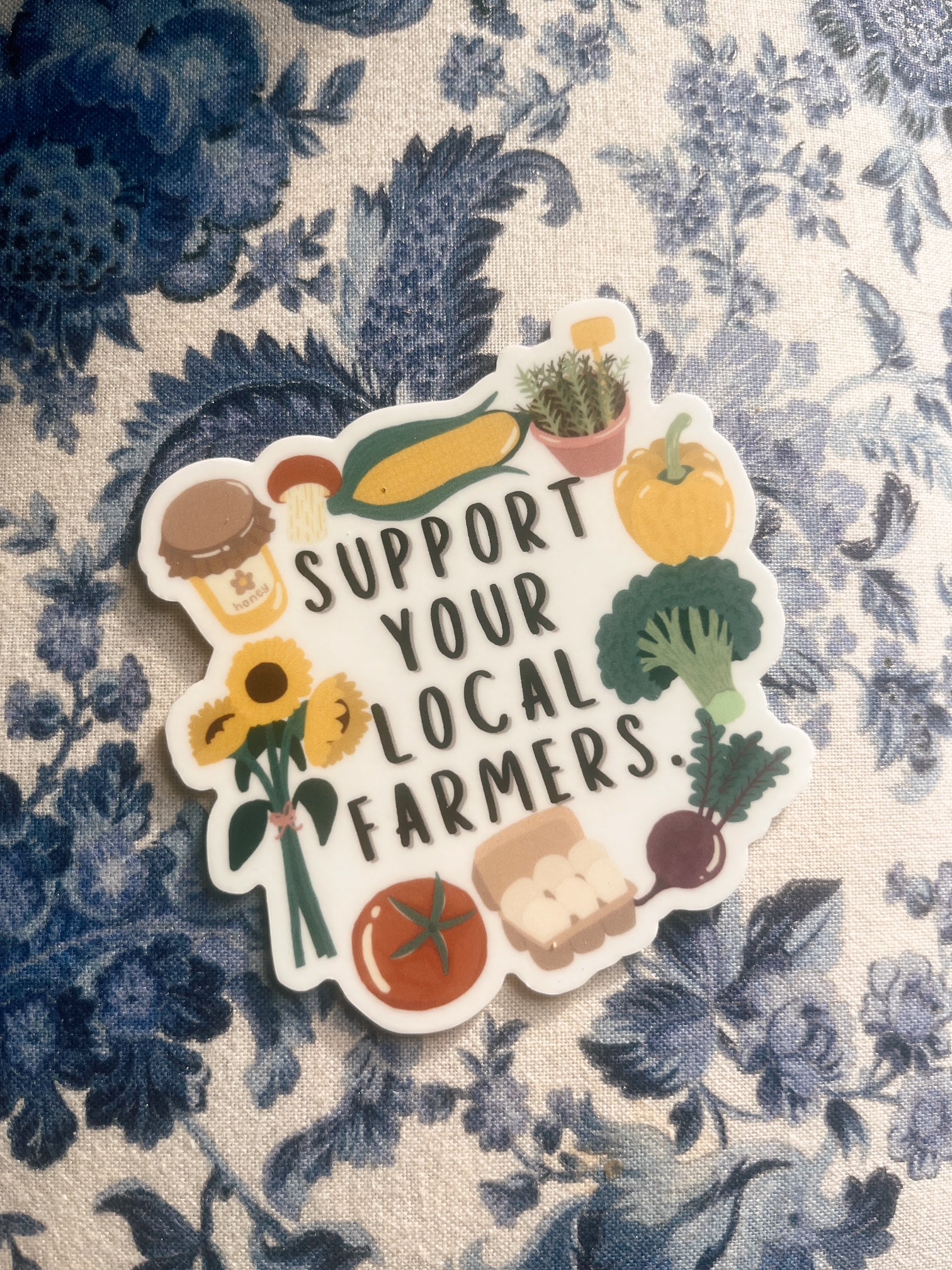 support your local farmers sticker on paisley fabric